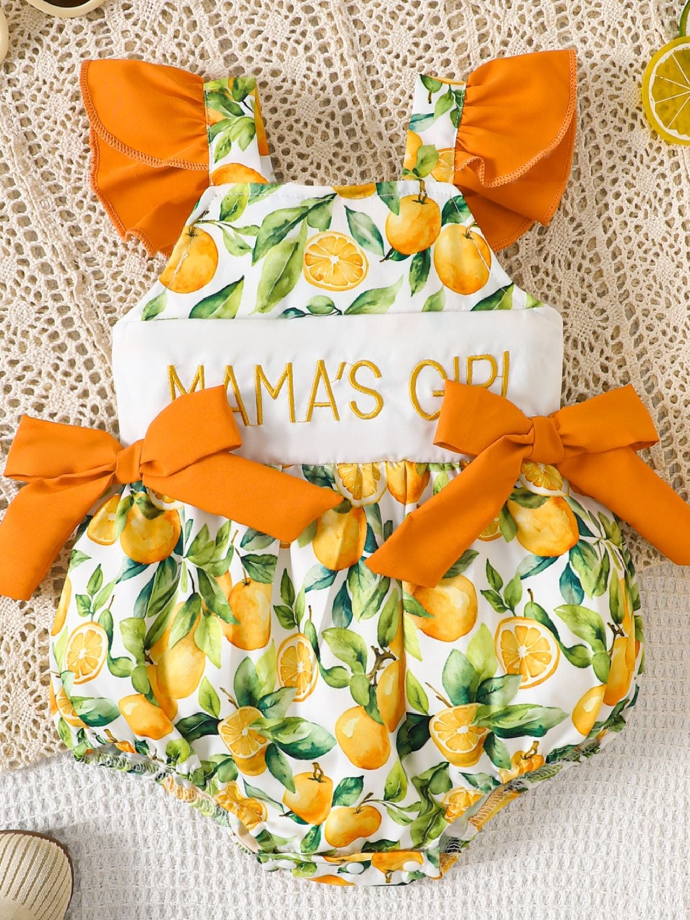 “Infant cow print romper with ruffle trim, sherbet color”