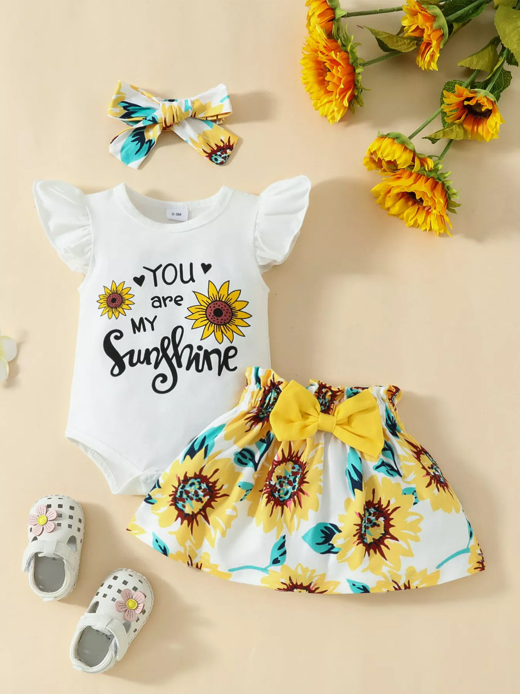 “Sunflower baby girl outfit with ruffled bodysuit, skirt, and headband”
