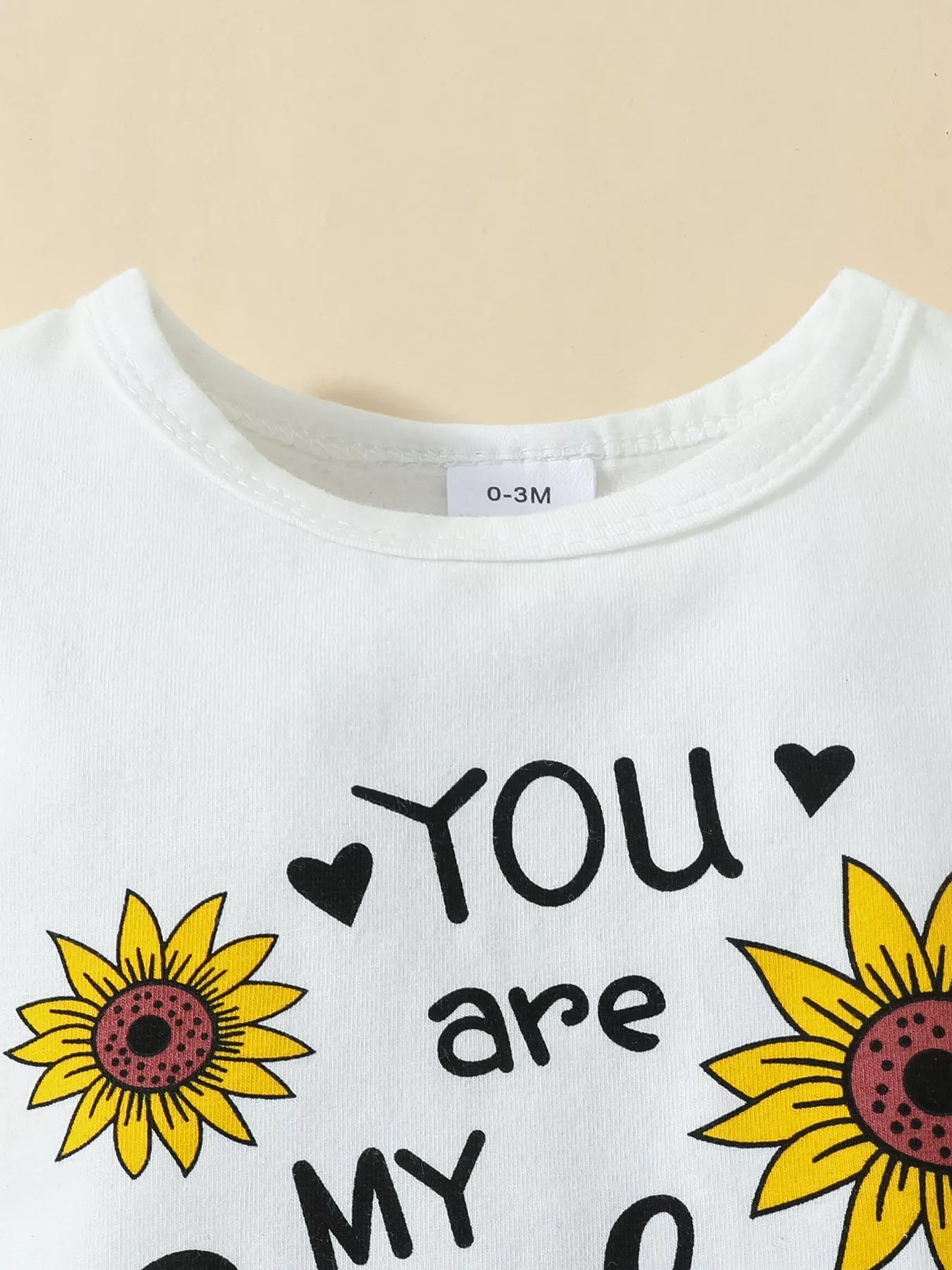 “Ruffled infant bodysuit and sunflower skirt outfit”