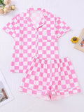 Women's pink checkered print button-up top and shorts lounge set, front view
