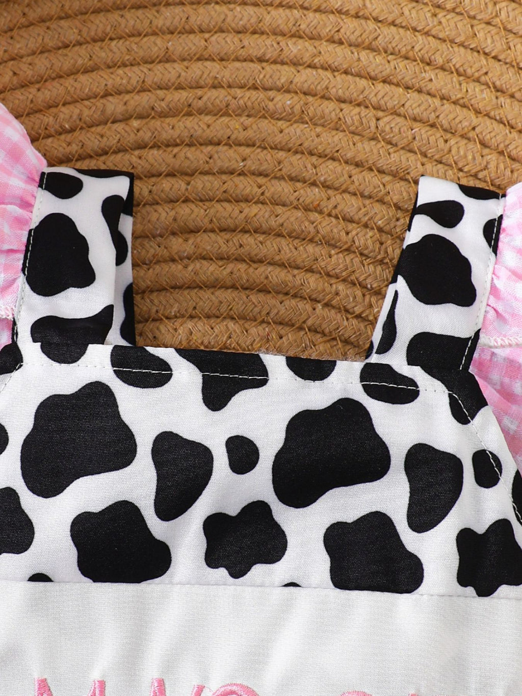 “Mama’s Girl infant outfit, cow print design, soft cotton blend
